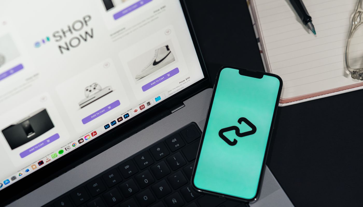 Laptop and smartphone displaying digital interfaces